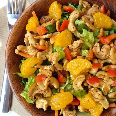 Chicken salad with nuts and fruit in bowl