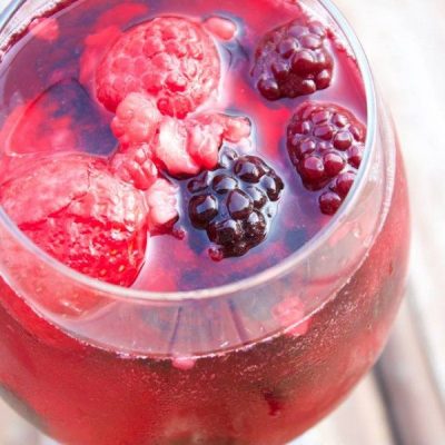 Berry skin wine cooler in glass on counter