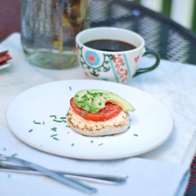 english muffin with cream cheese on white plate