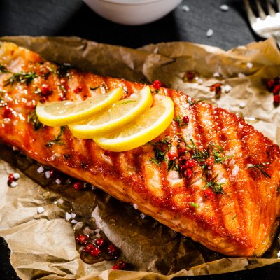 salmon with lemon on parchment paper
