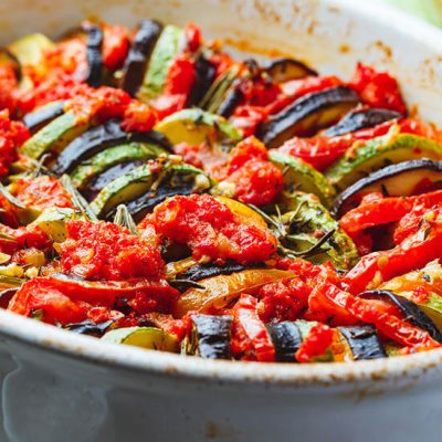 Vegetable ratatouille in white dish on counter